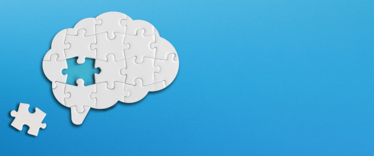 A brain puzzle piece missing on a blue background symbolizes employee assistance.